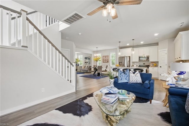 653 Waters Rd, Chesapeake, VA 23322 - living room with light wood-style flooring, stairs, a ceiling fan, and recessed lighting
