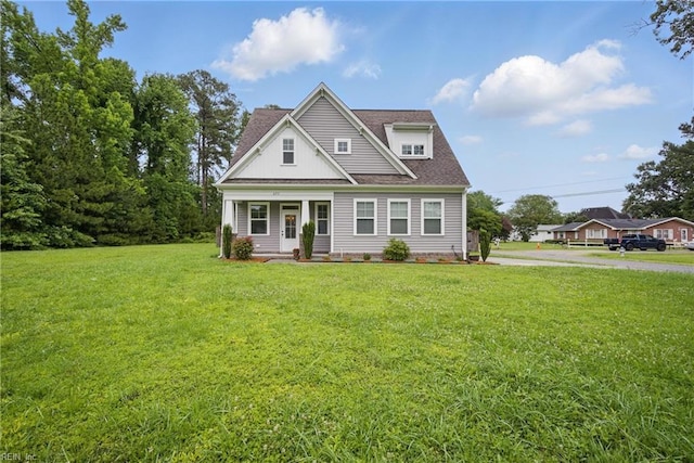 653 Waters Rd, Chesapeake, VA 23322 - view of front facade featuring a front yard, covered porch, and roof with shingles