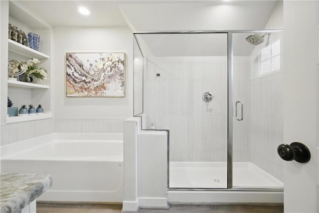 653 Waters Rd, Chesapeake, VA 23322 - full bathroom featuring a bath, a stall shower, and wood finished floors