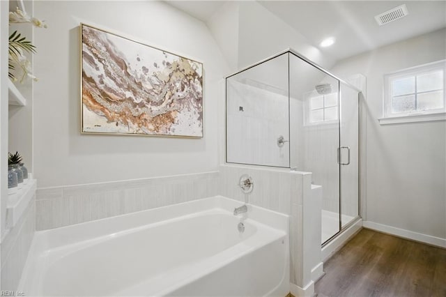 653 Waters Rd, Chesapeake, VA 23322 - bathroom with a garden tub, a stall shower, and wood finished floors