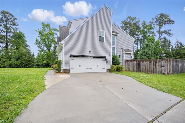653 Waters Rd, Chesapeake, VA 23322 - view of side of property featuring a garage and concrete driveway
