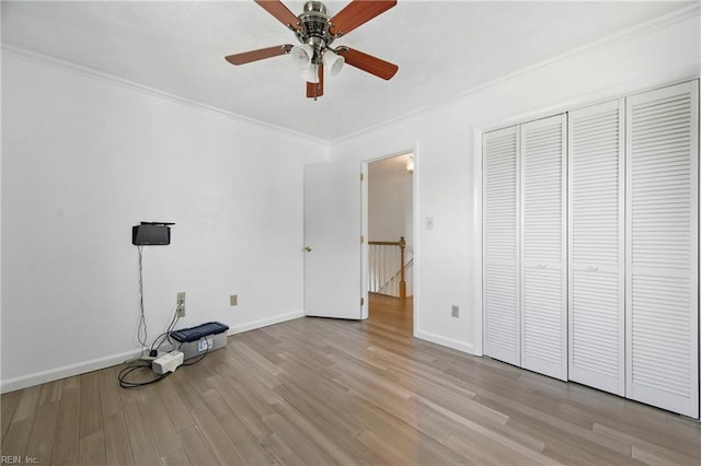 5 Still Harbor Ct, Hampton, VA 23669 - unfurnished bedroom with crown molding, wood finished floors, baseboards, a closet, and a ceiling fan