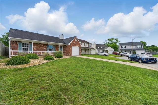 1713 Silver Springs Ct, Virginia Beach, VA 23456 - view of front of house with concrete driveway, brick siding, a garage, a chimney, and covered porch