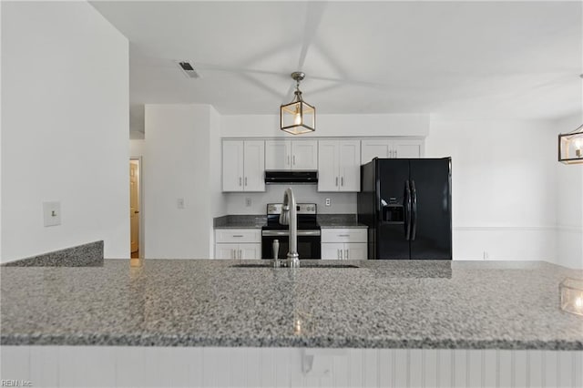1713 Silver Springs Ct, Virginia Beach, VA 23456 - kitchen featuring black fridge with ice dispenser, stainless steel electric stove, under cabinet range hood, and light stone countertops
