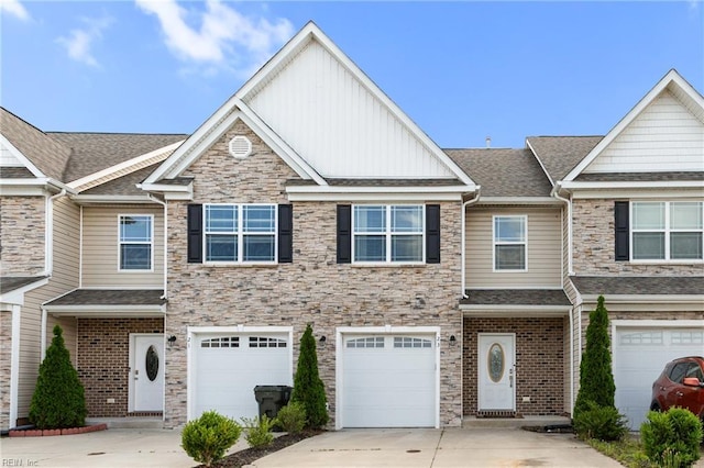 23 Mallory Way, Hampton, VA 23664 - multi unit property featuring driveway, board and batten siding, stone siding, a garage, and a shingled roof