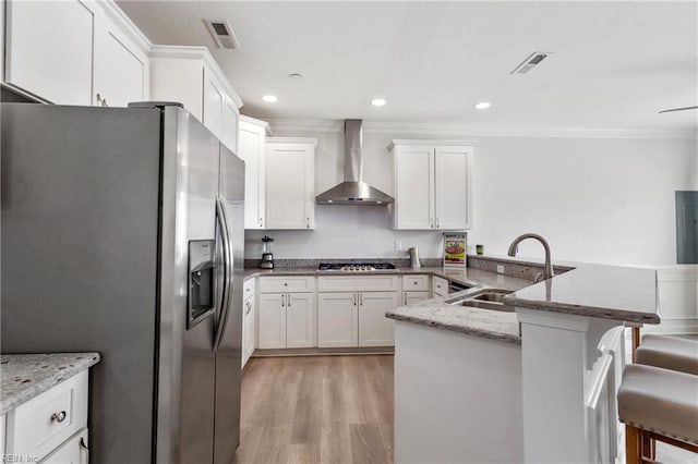 23 Mallory Way, Hampton, VA 23664 - kitchen featuring stainless steel appliances, wall chimney range hood, a sink, ornamental molding, and white cabinets