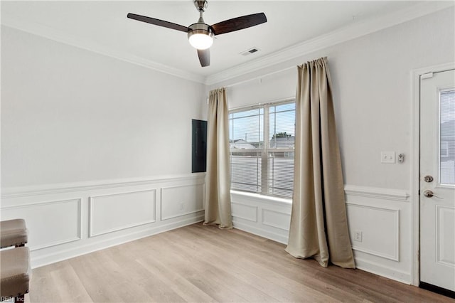 23 Mallory Way, Hampton, VA 23664 - spare room featuring a ceiling fan, ornamental molding, light wood-style floors, a decorative wall, and wainscoting