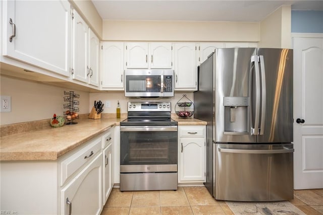 1020 Baydon Ln, Chesapeake, VA 23322 - kitchen featuring appliances with stainless steel finishes, white cabinetry, and light countertops
