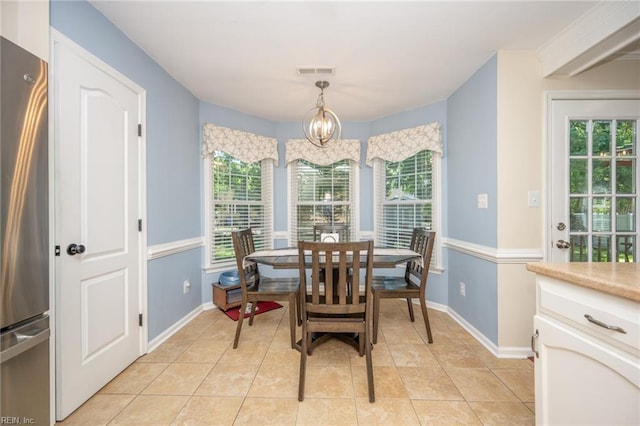 1020 Baydon Ln, Chesapeake, VA 23322 - dining room with healthy amount of natural light, a chandelier, and baseboards