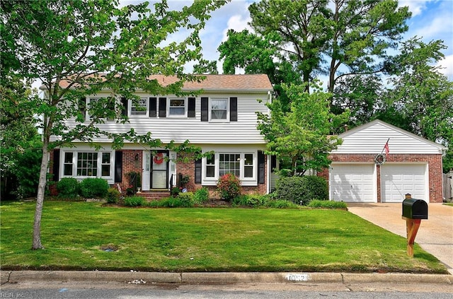 1052 Sunnyside Dr, Virginia Beach, VA 23464 - colonial house featuring brick siding, concrete driveway, a front lawn, and an attached garage