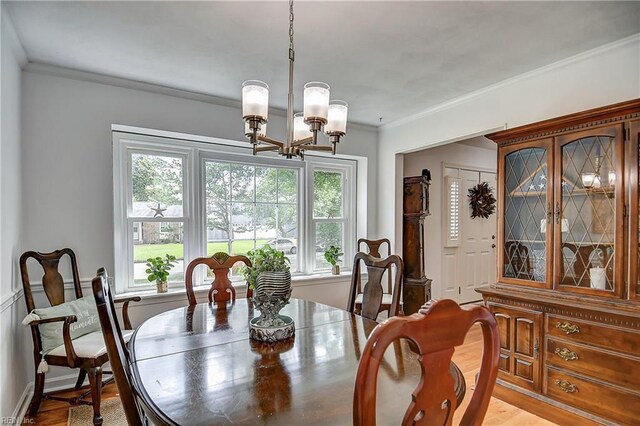 1052 Sunnyside Dr, Virginia Beach, VA 23464 - dining room with a chandelier, ornamental molding, and light wood finished floors