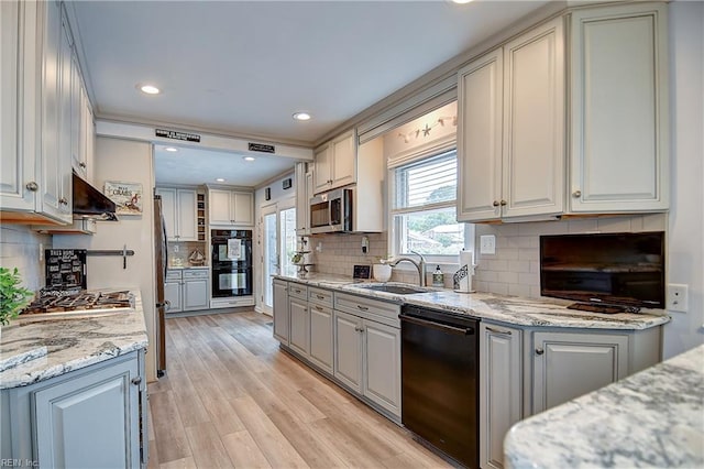 1052 Sunnyside Dr, Virginia Beach, VA 23464 - kitchen featuring black appliances, a sink, extractor fan, gray cabinets, and decorative backsplash