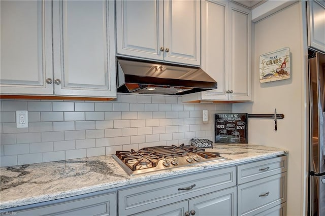1052 Sunnyside Dr, Virginia Beach, VA 23464 - kitchen featuring under cabinet range hood, stainless steel appliances, backsplash, and light stone countertops