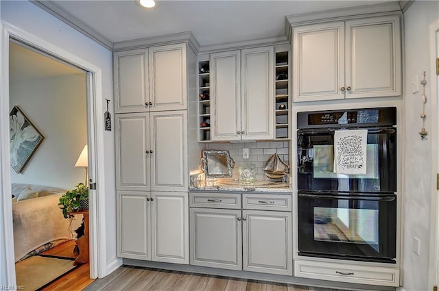 1052 Sunnyside Dr, Virginia Beach, VA 23464 - kitchen with open shelves, light wood-type flooring, gray cabinets, backsplash, and light stone countertops