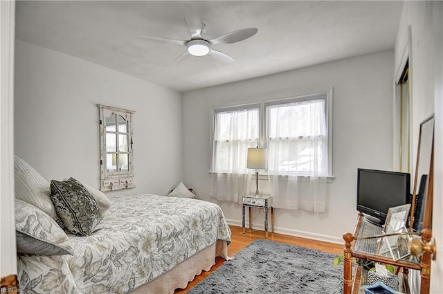 1052 Sunnyside Dr, Virginia Beach, VA 23464 - bedroom with multiple windows, wood finished floors, baseboards, and a ceiling fan