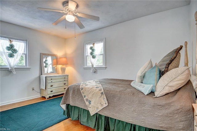 1052 Sunnyside Dr, Virginia Beach, VA 23464 - bedroom featuring wood finished floors, multiple windows, and ceiling fan