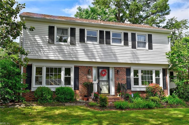 1052 Sunnyside Dr, Virginia Beach, VA 23464 - colonial inspired home with brick siding and a front lawn
