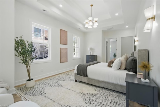 1653 Shipyard Rd, Chesapeake, VA 23323 - bedroom featuring a chandelier, recessed lighting, wood finished floors, baseboards, and a raised ceiling