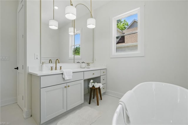 1653 Shipyard Rd, Chesapeake, VA 23323 - full bathroom featuring baseboards, healthy amount of natural light, a freestanding bath, and double vanity