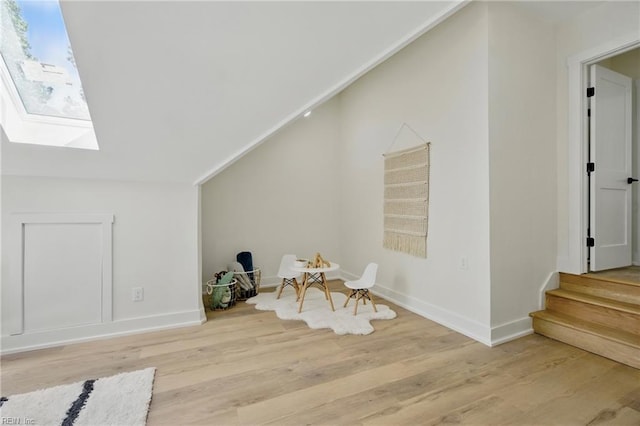 1653 Shipyard Rd, Chesapeake, VA 23323 - additional living space with a skylight, light wood-style floors, vaulted ceiling, baseboards, and stairs