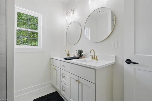 1653 Shipyard Rd, Chesapeake, VA 23323 - bathroom with double vanity, marble finish flooring, and baseboards