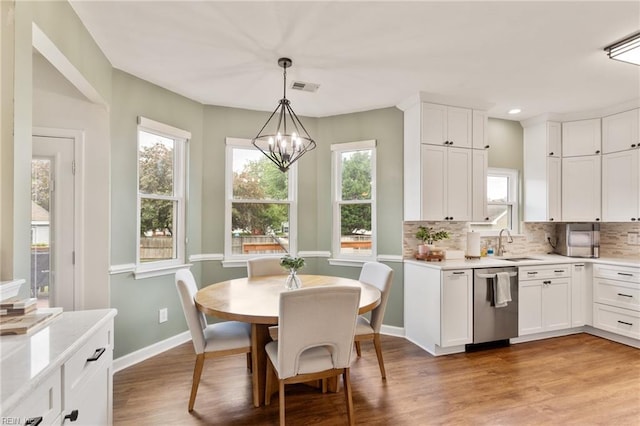 433 Fall Ridge Ln, Chesapeake, VA 23322 - dining room featuring a chandelier, plenty of natural light, light wood-style flooring, baseboards, and recessed lighting