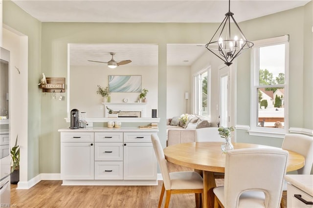 433 Fall Ridge Ln, Chesapeake, VA 23322 - dining room featuring light wood-style floors, a chandelier, ceiling fan, and baseboards