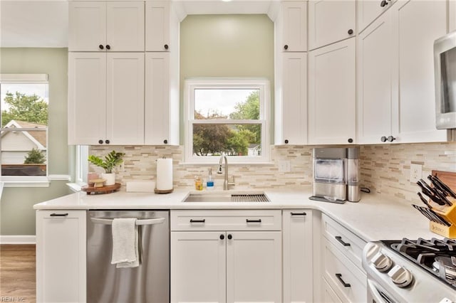 433 Fall Ridge Ln, Chesapeake, VA 23322 - kitchen with stainless steel appliances, a sink, and white cabinetry