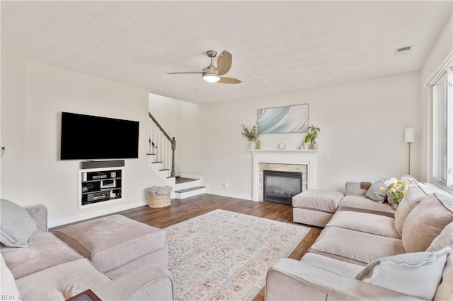 433 Fall Ridge Ln, Chesapeake, VA 23322 - living room featuring wood finished floors, a glass covered fireplace, stairway, ceiling fan, and baseboards
