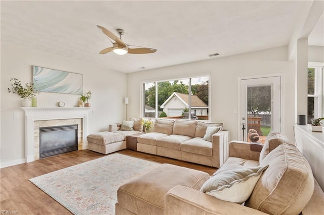 433 Fall Ridge Ln, Chesapeake, VA 23322 - living area with a ceiling fan, wood finished floors, a glass covered fireplace, and baseboards