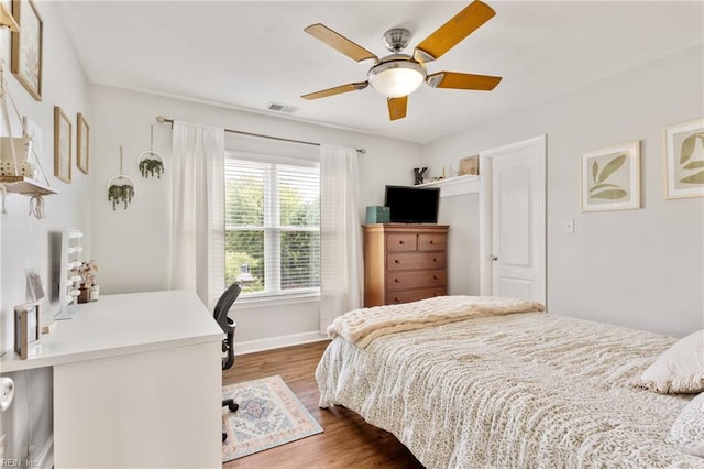 433 Fall Ridge Ln, Chesapeake, VA 23322 - bedroom featuring dark wood-style floors, a desk, baseboards, and a ceiling fan