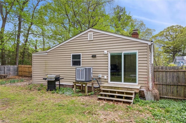 203 Old Seaford Rd, Seaford, VA 23696 - rear view of house featuring cooling unit and a chimney