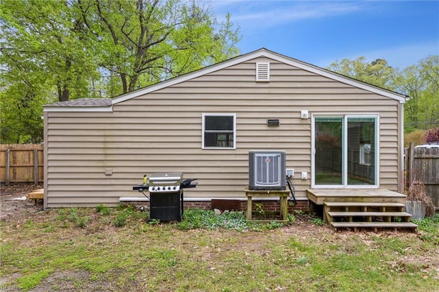 203 Old Seaford Rd, Seaford, VA 23696 - back of property featuring central AC and a deck
