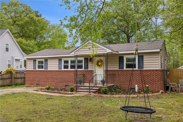 203 Old Seaford Rd, Seaford, VA 23696 - bungalow-style home with brick siding, crawl space, and roof with shingles
