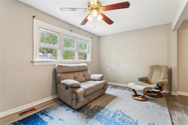 203 Old Seaford Rd, Seaford, VA 23696 - living area with wood finished floors, baseboards, and ceiling fan