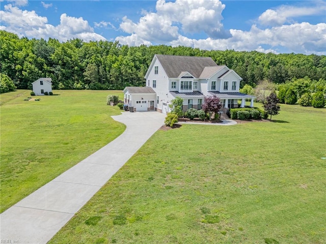 2033 Camden Ct, Virginia Beach, VA 23457 - view of front facade featuring a front lawn, driveway, covered porch, and a wooded view