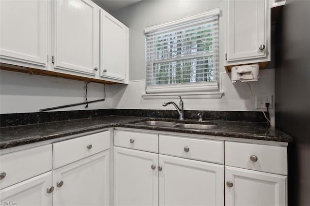 500 Mango Dr, Virginia Beach, VA 23452 - kitchen featuring a sink, white cabinetry, dark stone countertops, and freestanding refrigerator