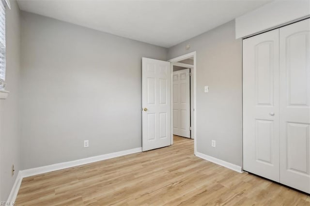 500 Mango Dr, Virginia Beach, VA 23452 - unfurnished bedroom featuring light wood-style flooring, baseboards, and a closet