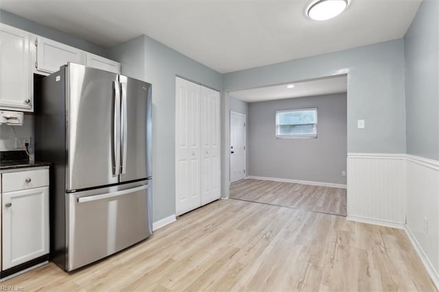 500 Mango Dr, Virginia Beach, VA 23452 - kitchen featuring freestanding refrigerator, light wood-style floors, white cabinetry, and baseboards