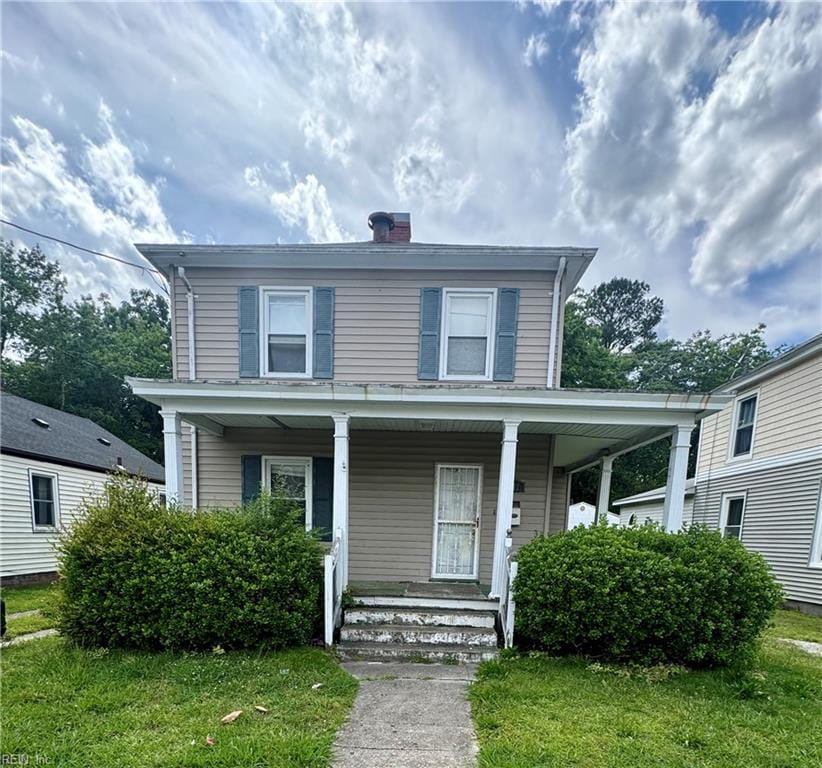207 Saint James Ave, Suffolk, VA 23434 - view of front facade featuring a porch, a chimney, and a front yard