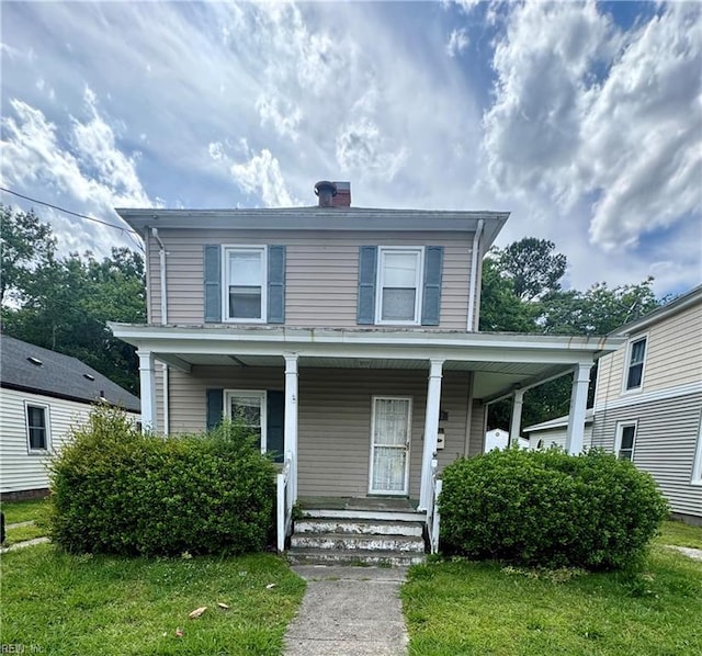 207 Saint James Ave, Suffolk, VA 23434 - view of front facade featuring a porch, a chimney, and a front yard