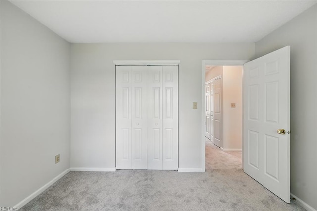 1518 River Creek Cres, Suffolk, VA 23434 - unfurnished bedroom featuring light colored carpet, baseboards, and a closet
