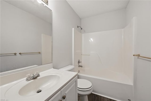 1518 River Creek Cres, Suffolk, VA 23434 - bathroom featuring toilet, vanity,  shower combination, wood finished floors, and a textured ceiling