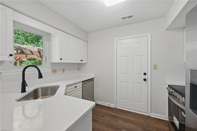 1518 River Creek Cres, Suffolk, VA 23434 - kitchen with a sink, stainless steel appliances, dark wood-style floors, light countertops, and white cabinets