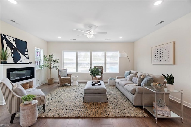 704 Fishermans Rd, Norfolk, VA 23503 - living area with plenty of natural light, ceiling fan, a glass covered fireplace, wood finished floors, and recessed lighting