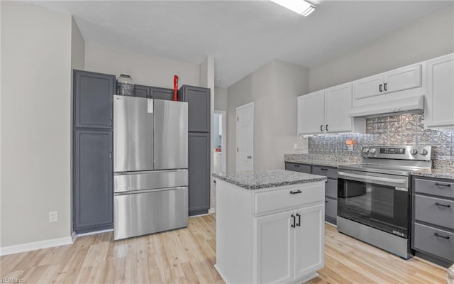 6329 Pelican Cres S, Suffolk, VA 23435 - kitchen with stainless steel appliances, under cabinet range hood, light wood-style floors, and light stone countertops