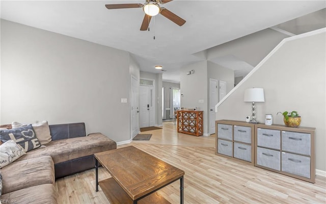 6329 Pelican Cres S, Suffolk, VA 23435 - living area with a ceiling fan, light wood finished floors, stairs, and baseboards
