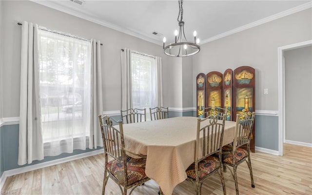 6329 Pelican Cres S, Suffolk, VA 23435 - dining space featuring a chandelier, light wood-style floors, ornamental molding, and baseboards