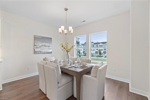 710 Fishermans Rd, Norfolk, VA 23503 - dining space with a chandelier, wood finished floors, and baseboards