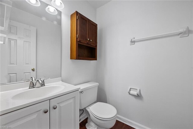 104 Camden Way Unit G, Yorktown, VA 23693 - bathroom featuring vanity, toilet, wood finished floors, and baseboards
